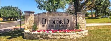 Crew members finishing a commercial concrete pour in Bedford, TX.