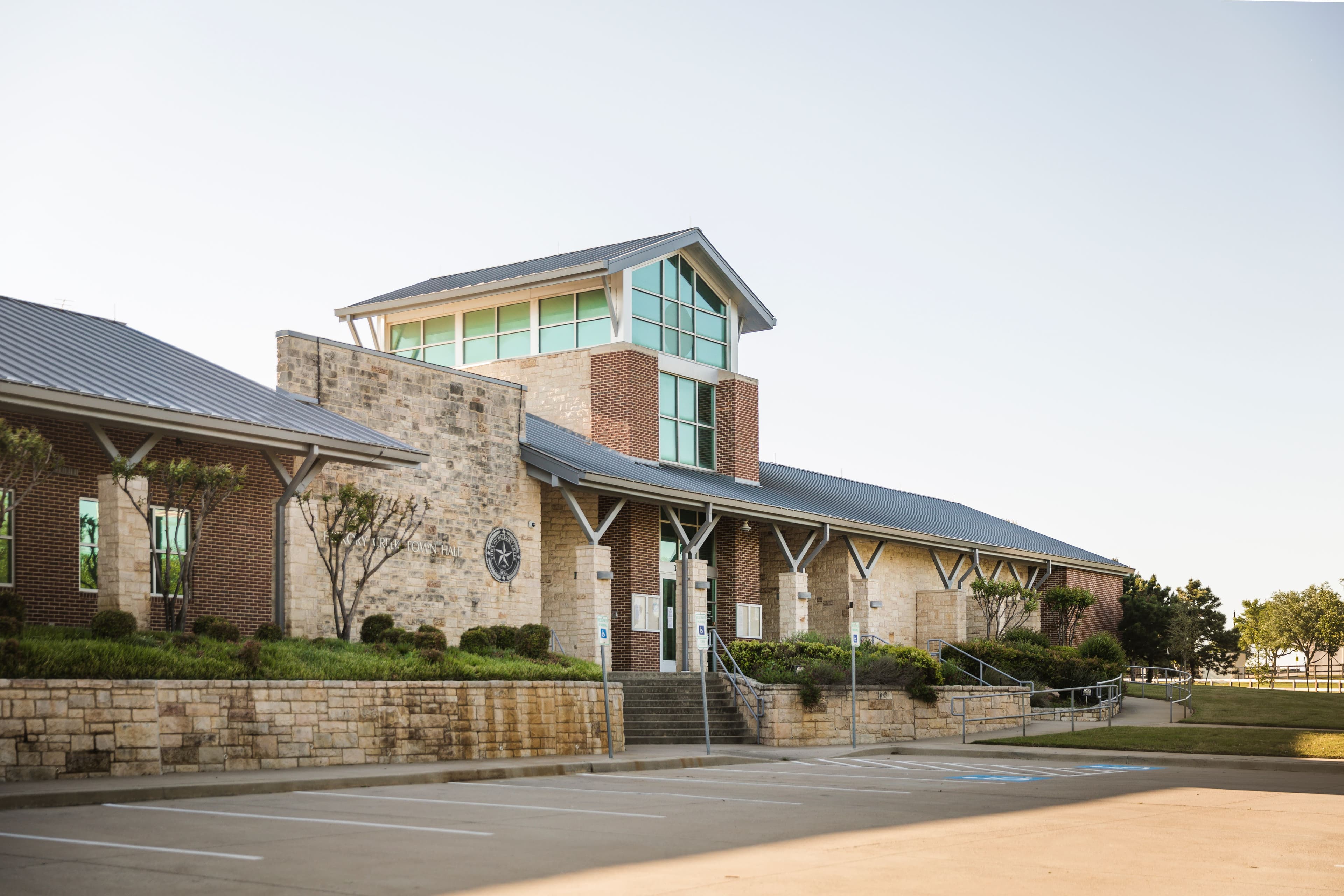 Crew members finishing a commercial concrete pour in Hickory Creek, TX.